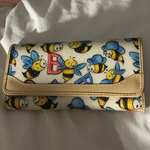 Dooney and bourke bee wallet with check insert. Never used. Perfect condition